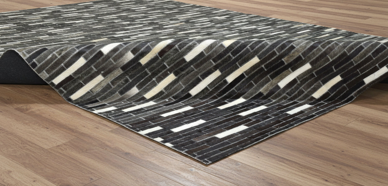Sallee Handmade Charcoal Black Stripes Leather Rug | Modern Patchwork Cowhide Area Rug